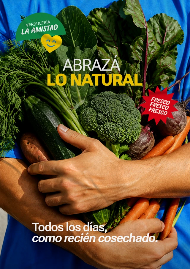 Afiche publicitario de La Amistad con verduras frescas, una persona abrazando vegetales y el mensaje “Abrazá lo natural”, expuesto en una pared de la calle.